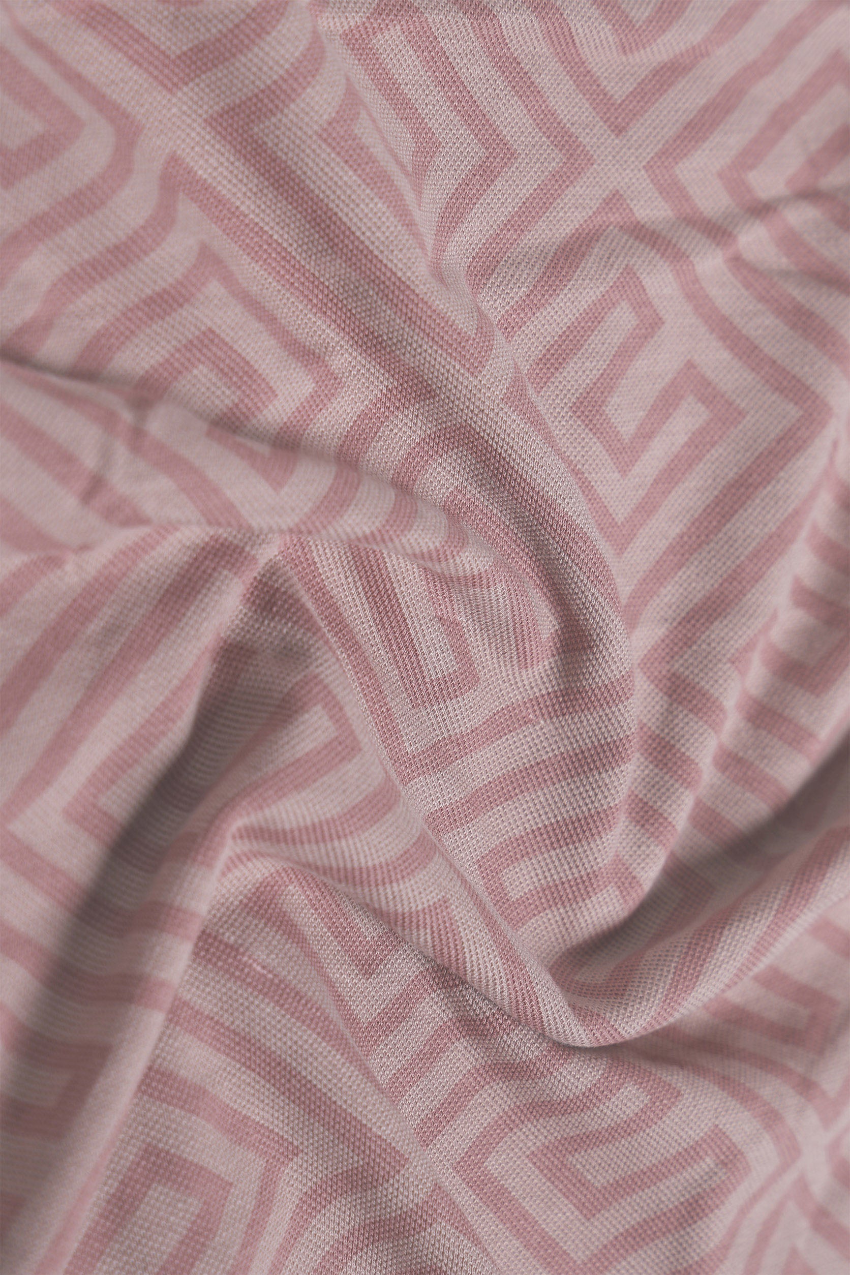 Close-up of pink fabric with geometric pattern