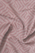 Close-up of pink fabric with geometric pattern
