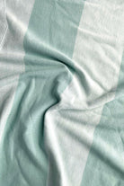 Close-up of light blue fabric with a checkered pattern