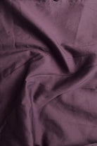 Close-up of purple fabric with folds