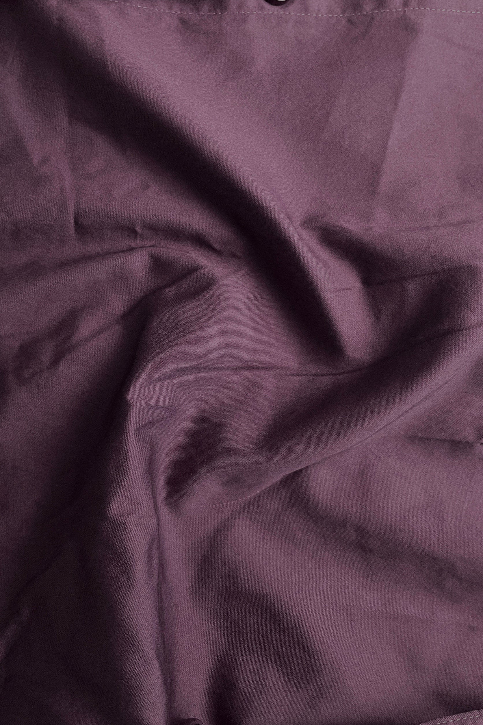 Close-up of purple fabric with folds
