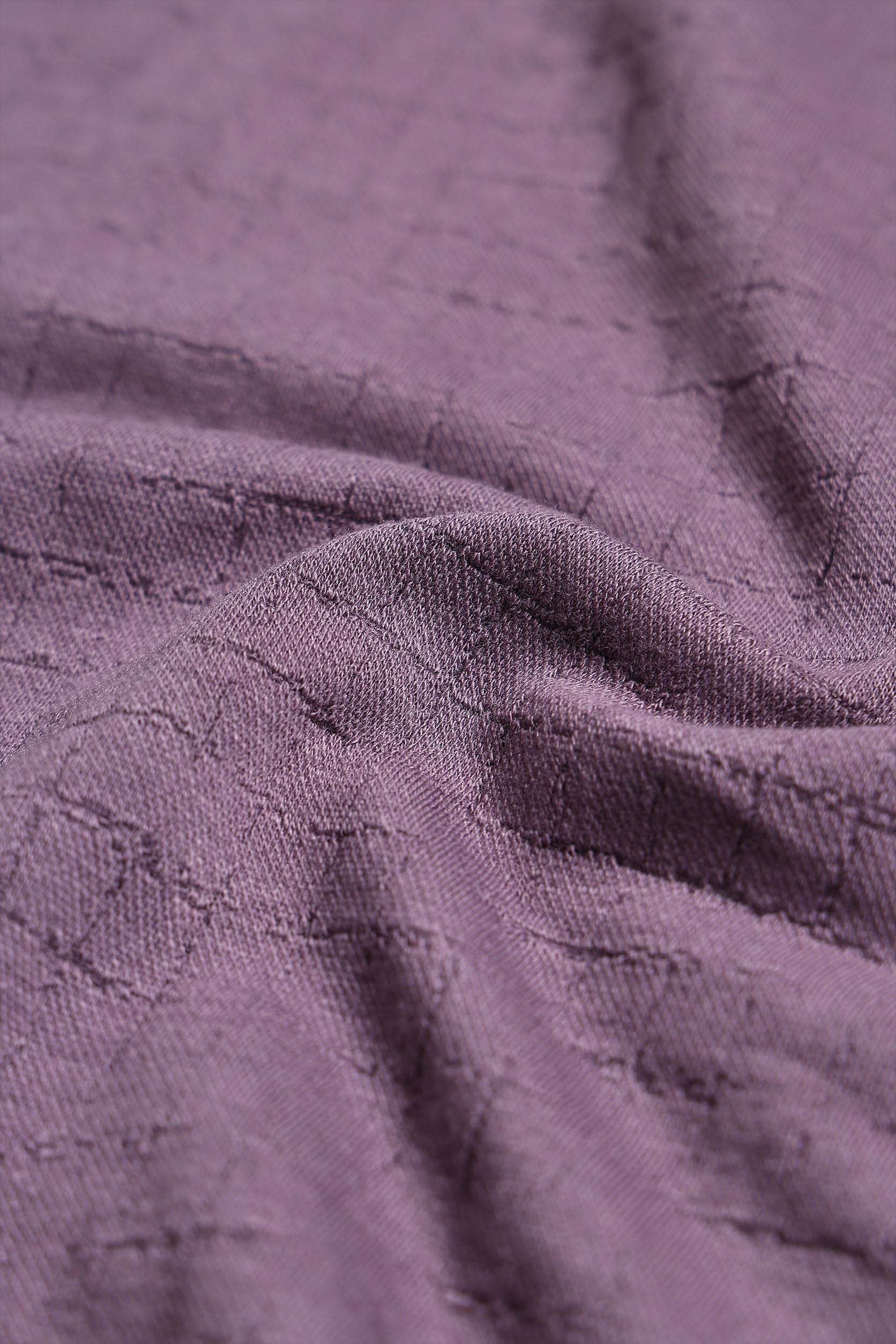 Close-up of textured purple fabric