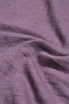 Close-up of textured purple fabric