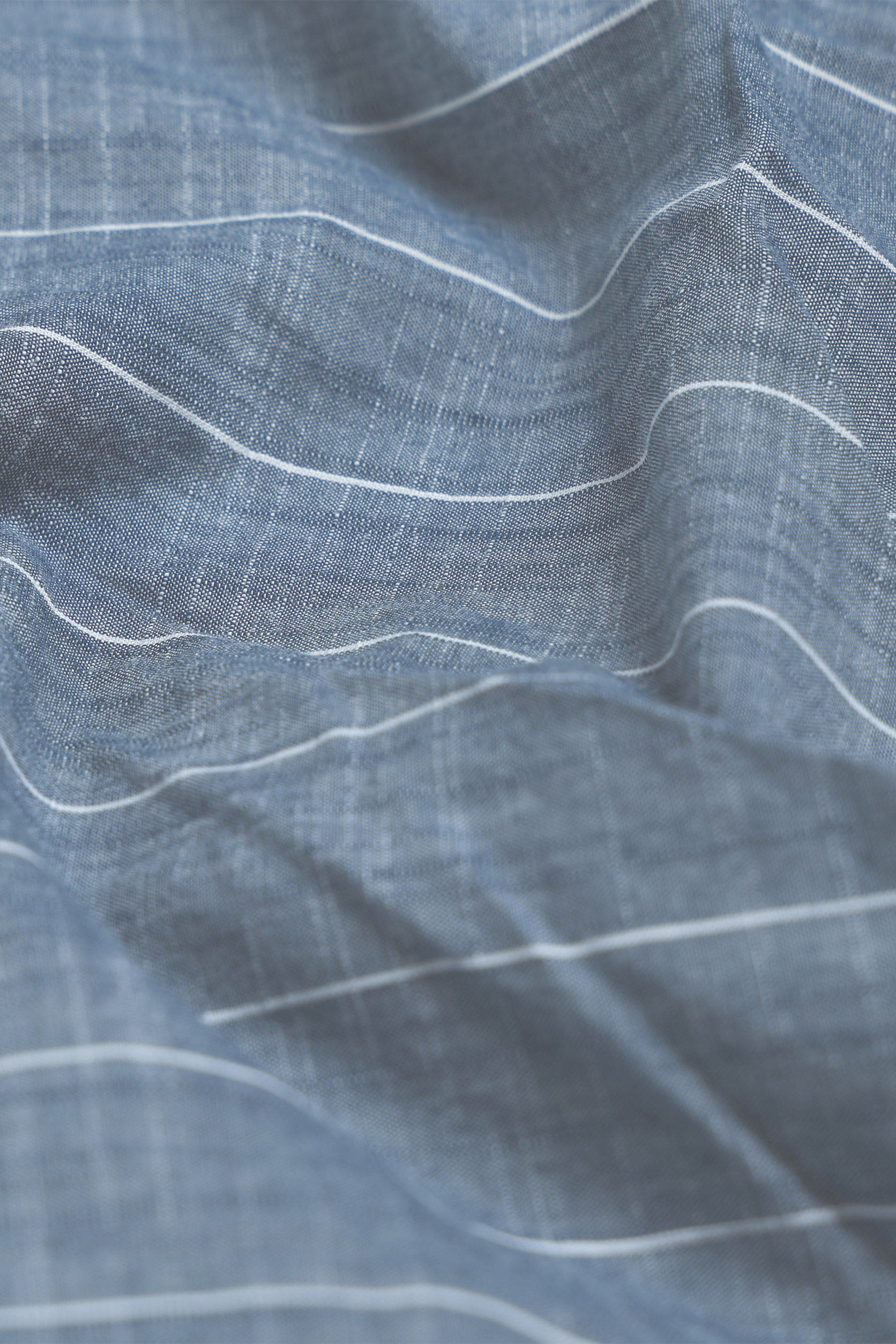 Close-up of blue fabric with white lines