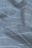 Close-up of blue fabric with white lines