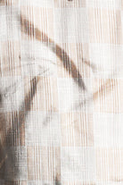Close-up of woven fabric with a neutral color palette
