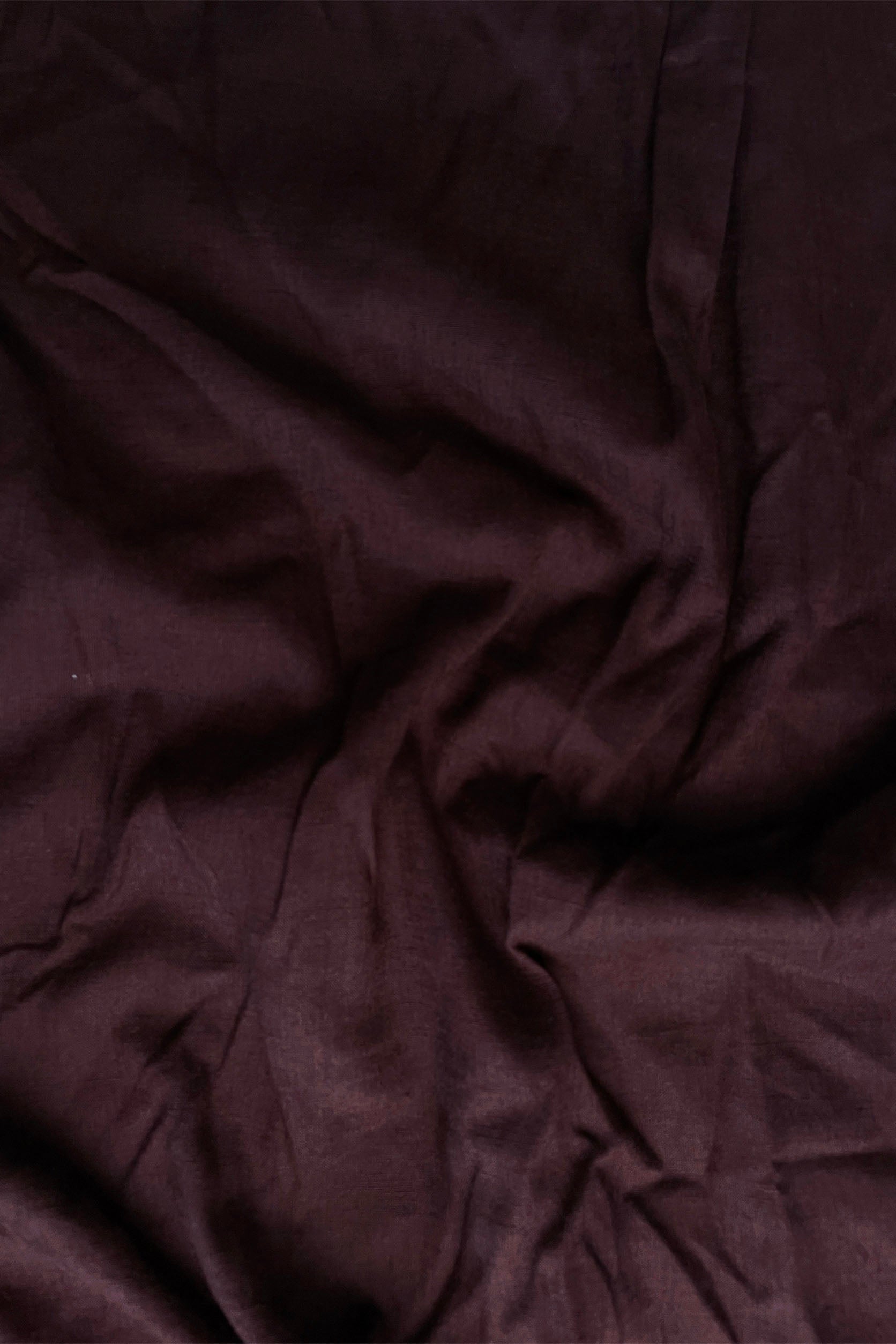 Close-up of dark brown fabric with visible texture