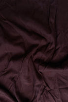 Close-up of dark brown fabric with visible texture