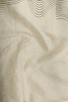 Close-up of beige fabric with subtle wave pattern