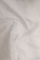 Close-up of textured beige fabric