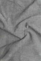 Close-up of gray fabric with a subtle texture