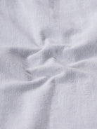 Man wearing a grey rib textured cotton shirt grey on a light gray background