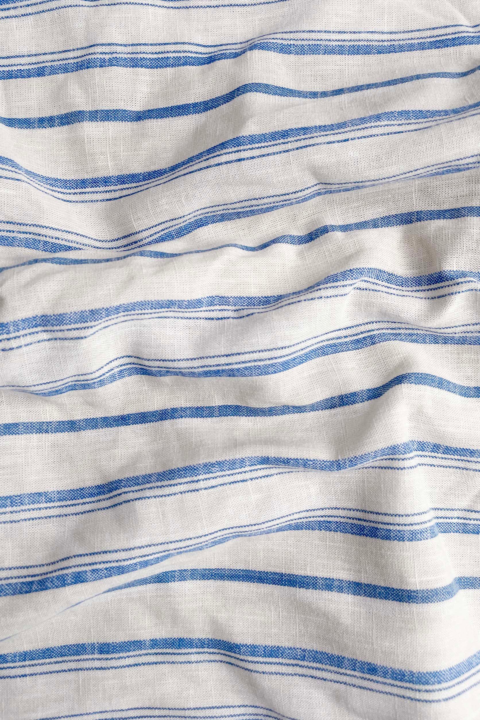 Close-up of fabric with blue and white horizontal stripes