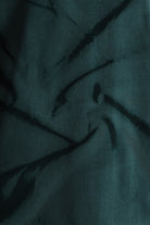 Dark fabric with feather-like patterns