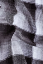 Close-up of a textured fabric with black and white patterns