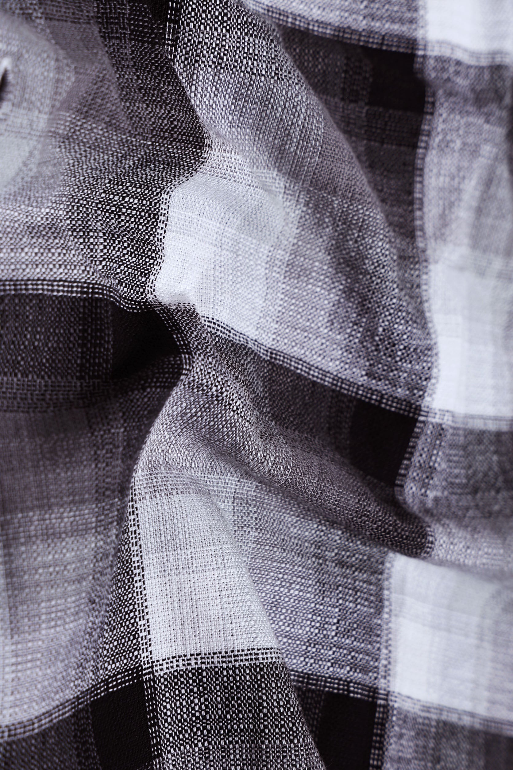 Close-up of a textured fabric with black and white patterns