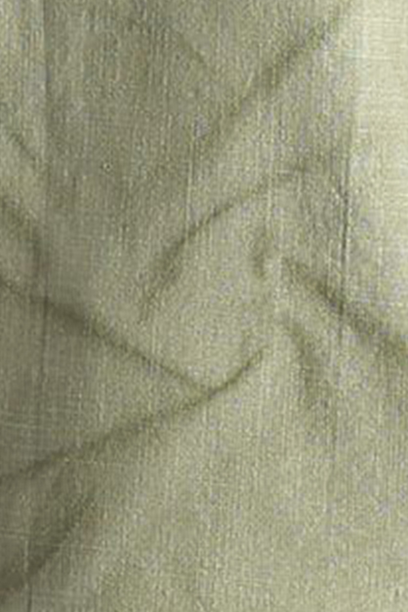 Close-up of green fabric with a textured pattern