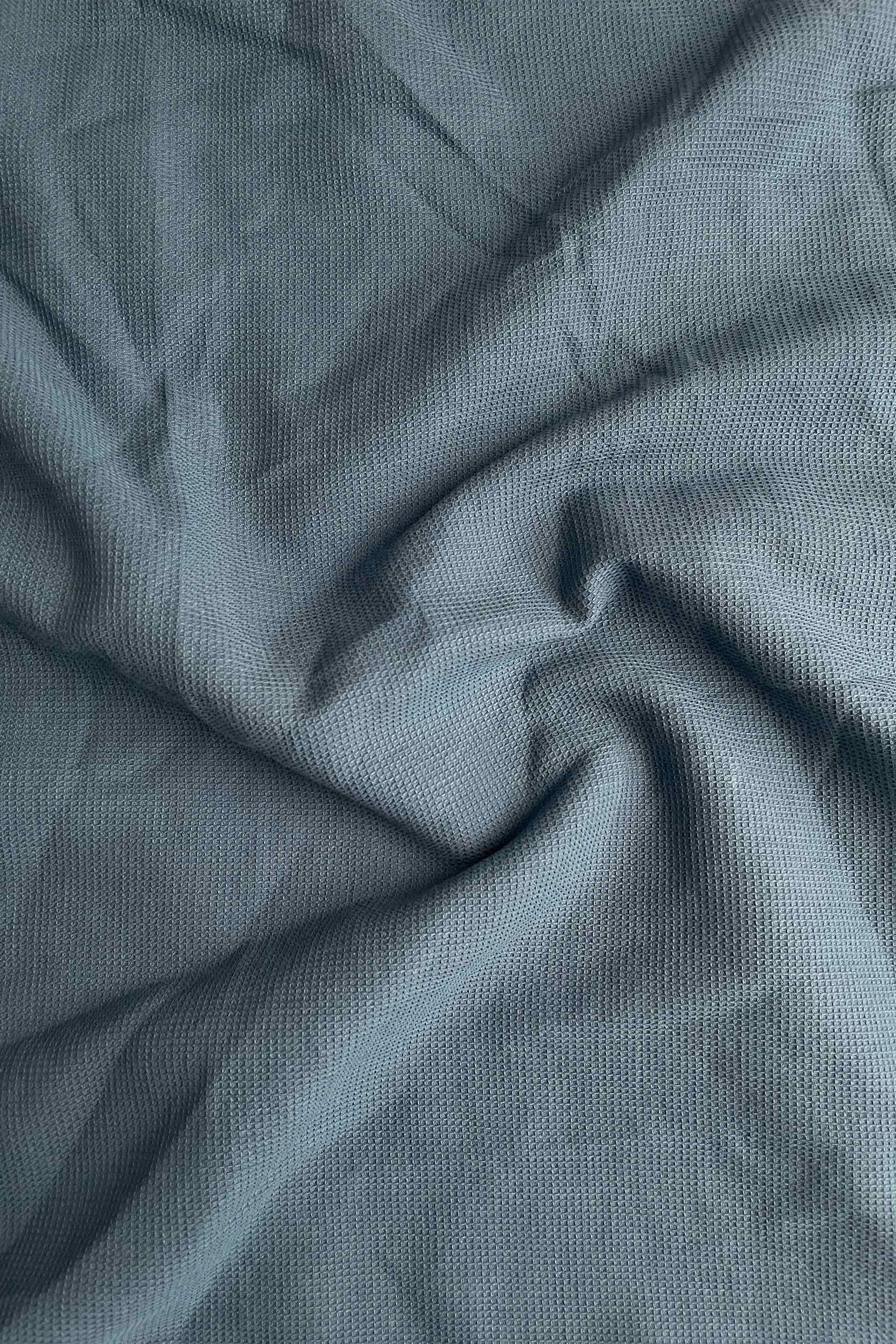 Close-up of textured blue fabric