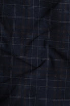 Close-up of dark blue fabric with a subtle check pattern