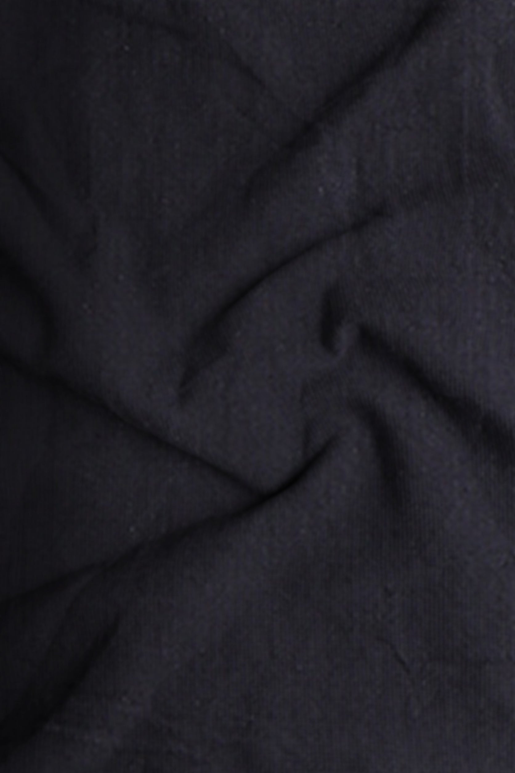 Close-up of dark gray fabric with visible texture