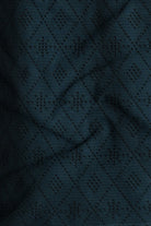 Dark blue fabric with a diamond pattern