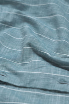 Close-up of blue fabric with white lines