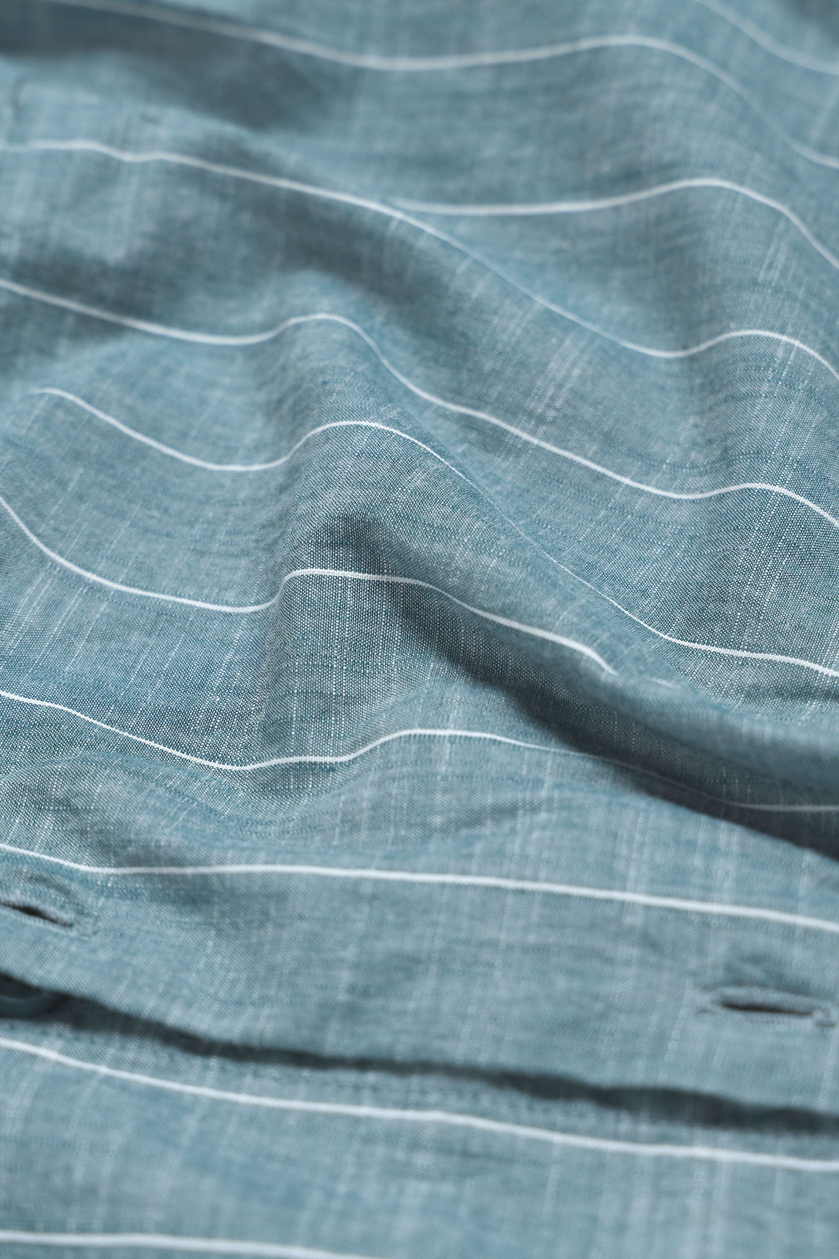Close-up of blue fabric with white lines