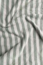 Close-up of striped fabric with alternating light and dark gray stripes.