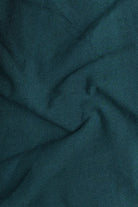 Close-up of teal fabric with folds