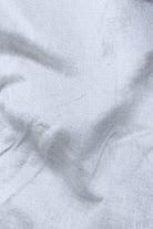 Close-up of gray fabric with folds