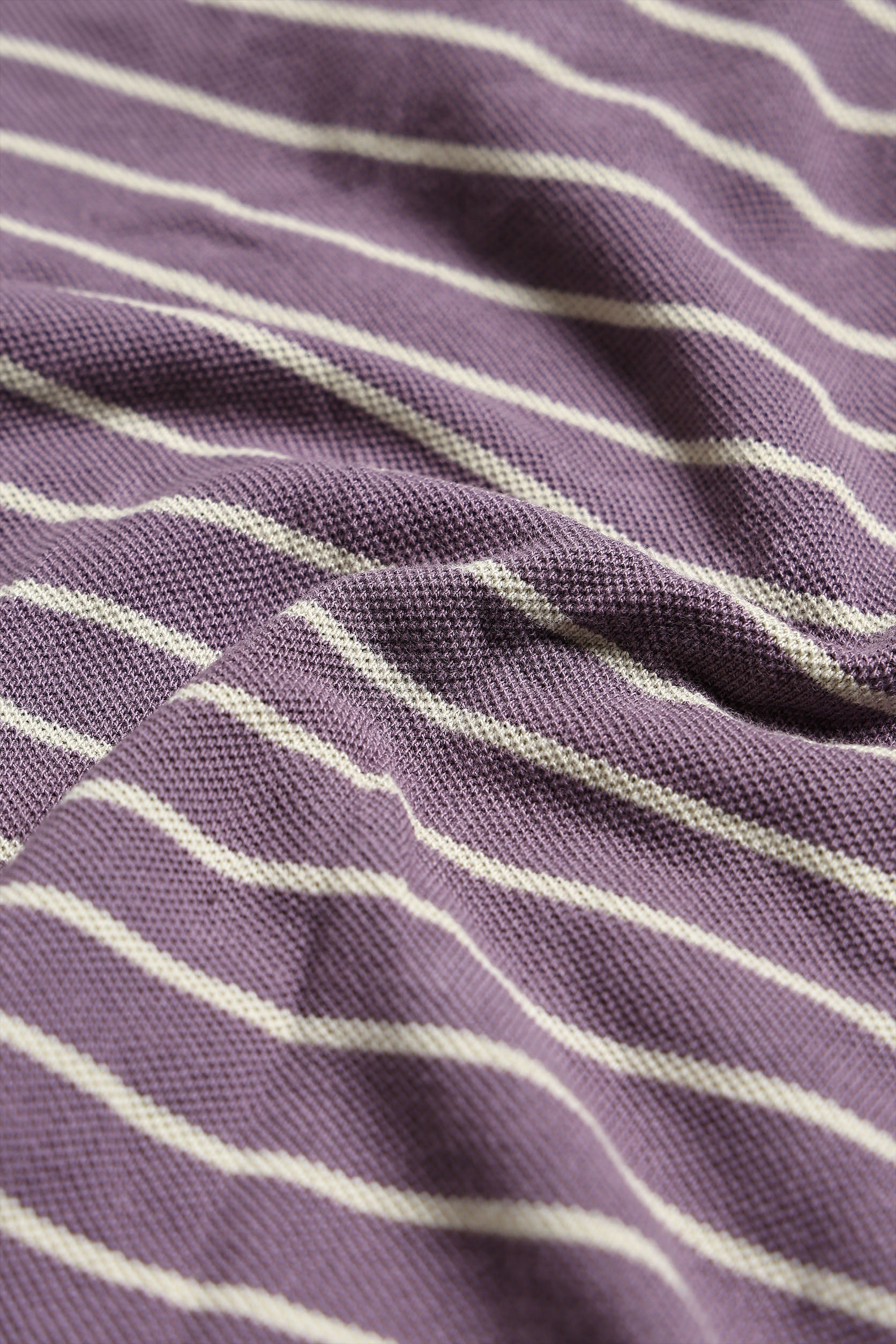 Close-up of purple fabric with white stripes