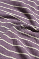 Close-up of purple fabric with white stripes
