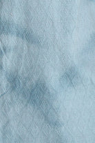 Close-up of textured light blue fabric