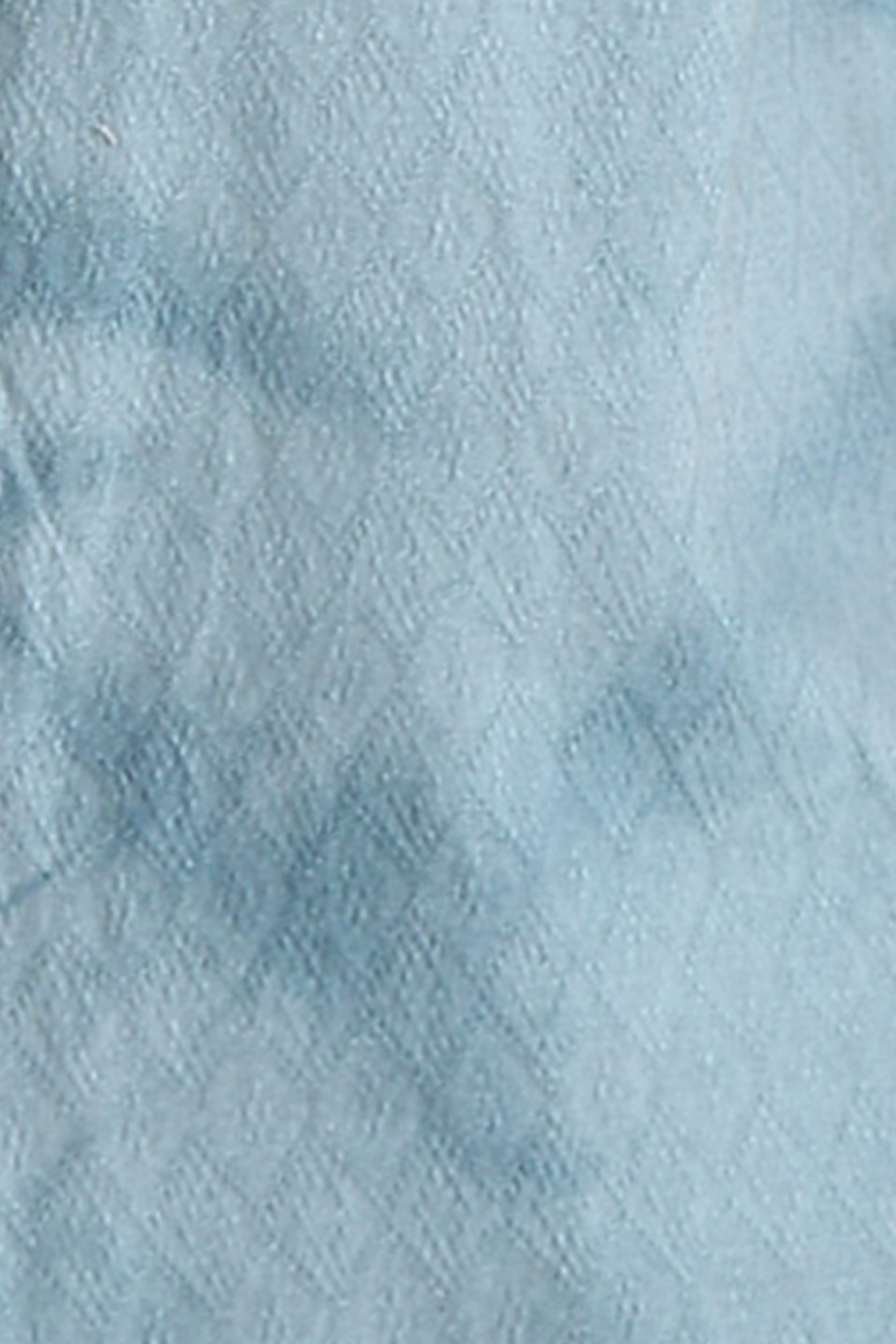 Close-up of textured light blue fabric