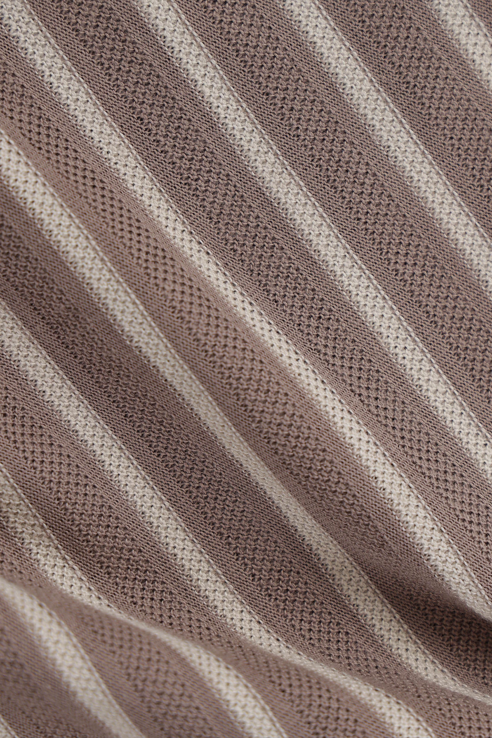 Close-up of brown fabric with a textured pattern