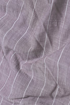 Close-up of purple fabric with white lines