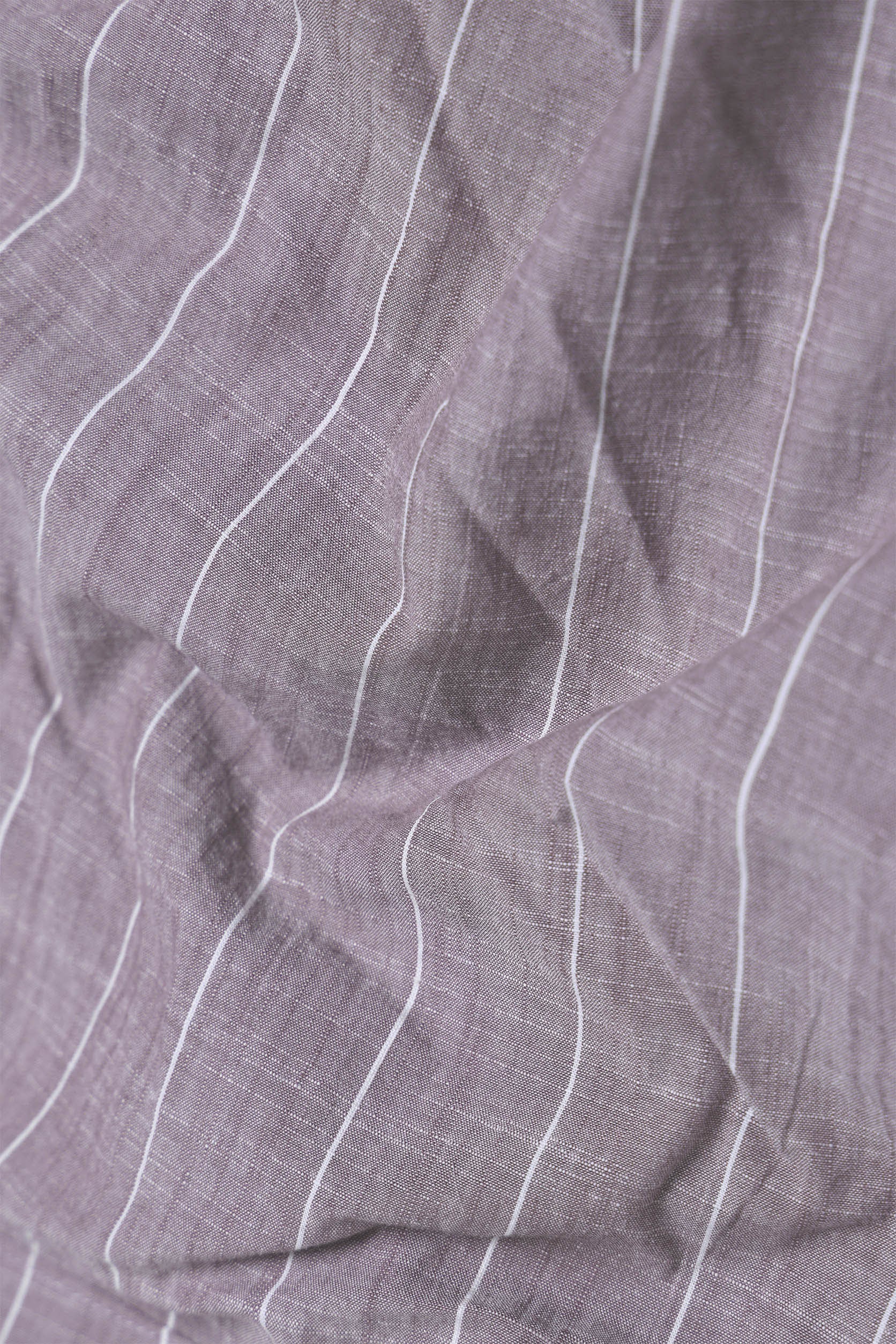 Close-up of purple fabric with white lines