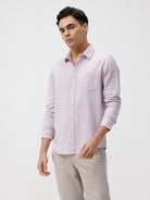 Man wearing a red rib textured cotton shirt light purple on a light gray background