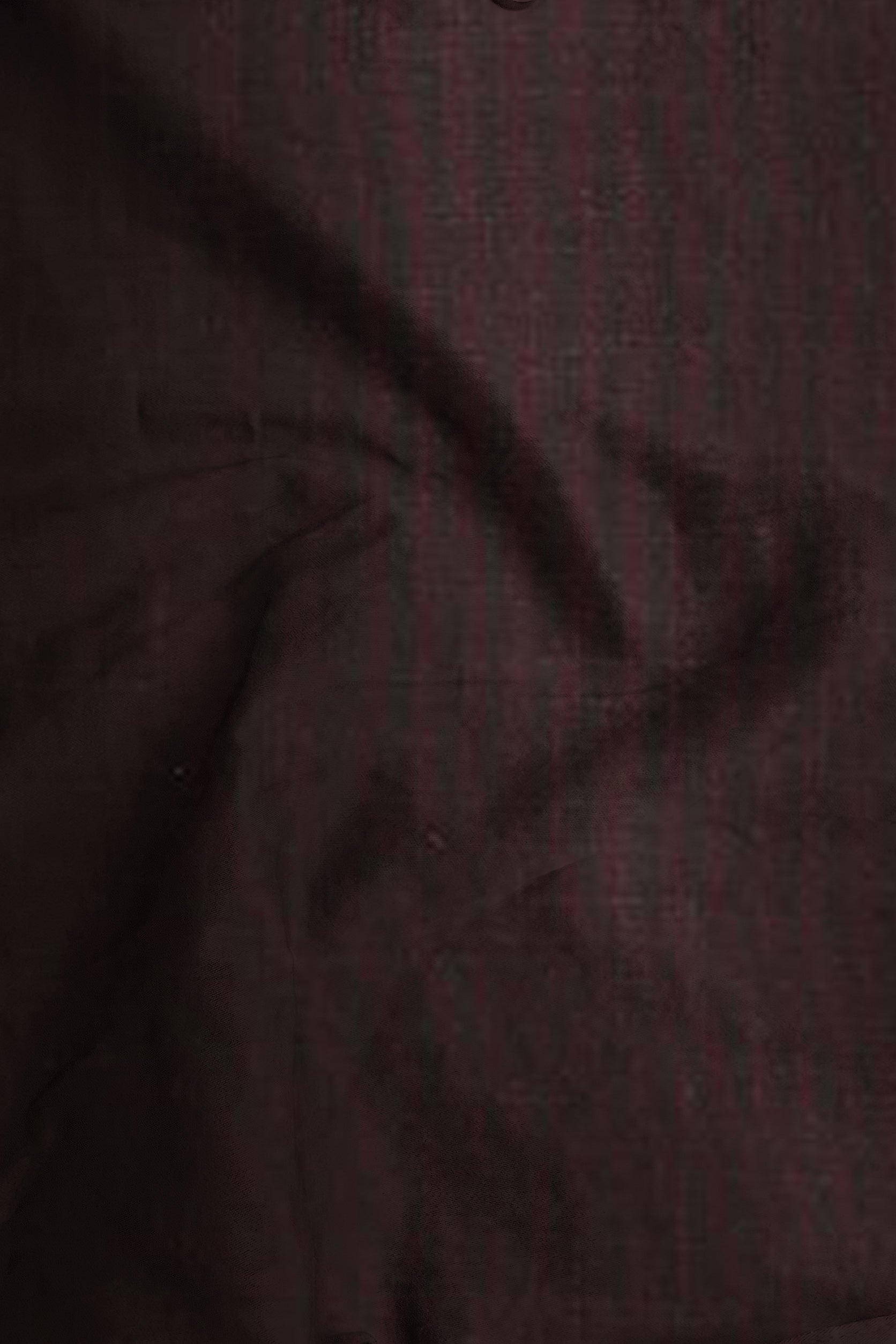 Close-up of dark brown fabric texture
