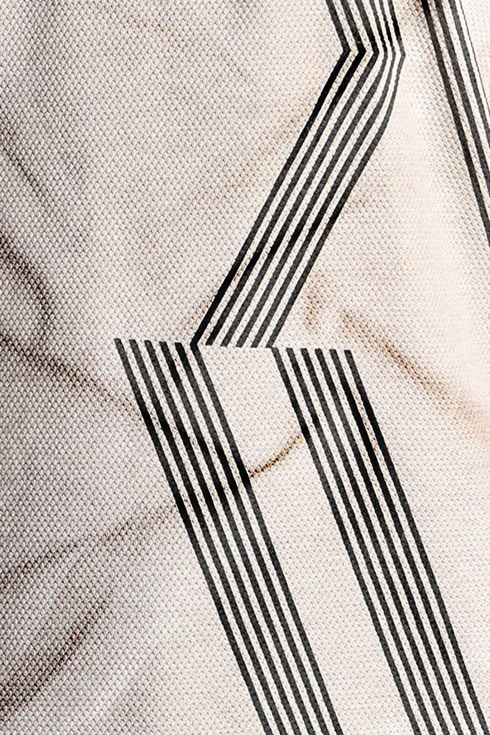 Close-up of a textured surface with black geometric patterns