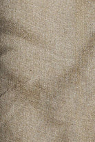 Close-up of a textured beige fabric surface