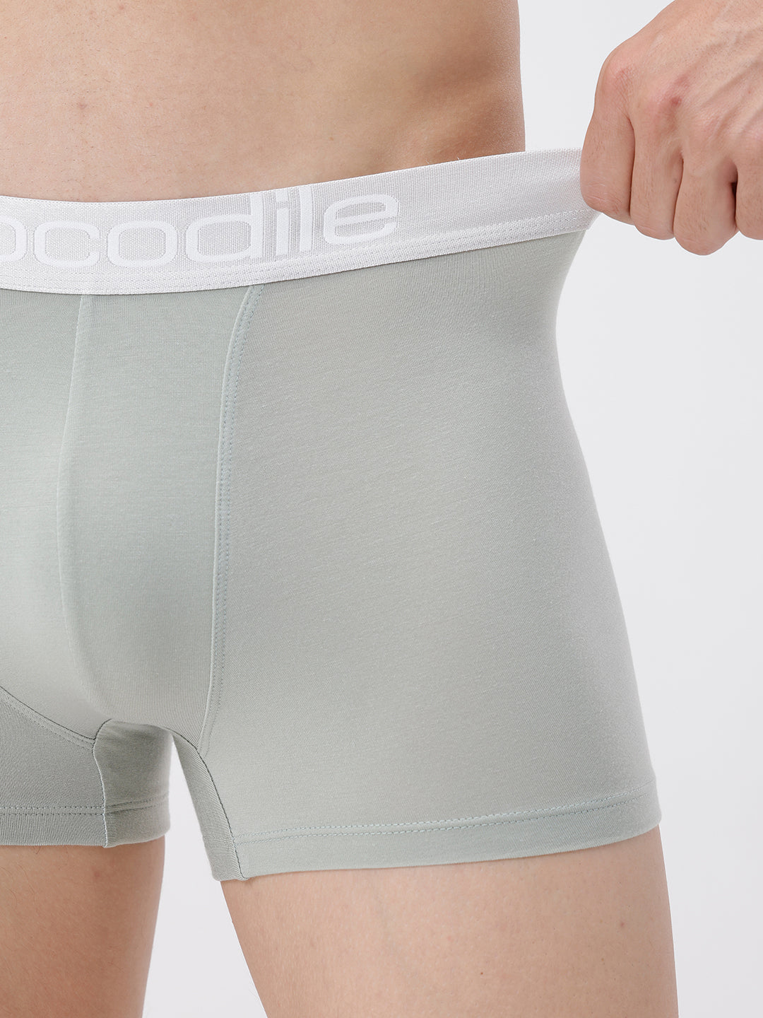 Gray boxer briefs with a white waistband being worn.