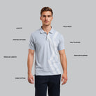 Man wearing a light gray polo shirt with white patterns on a gray background