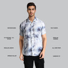 Man wearing a patterned shirt with text detailing fabric blend, sleeve length, and other features on a gray background