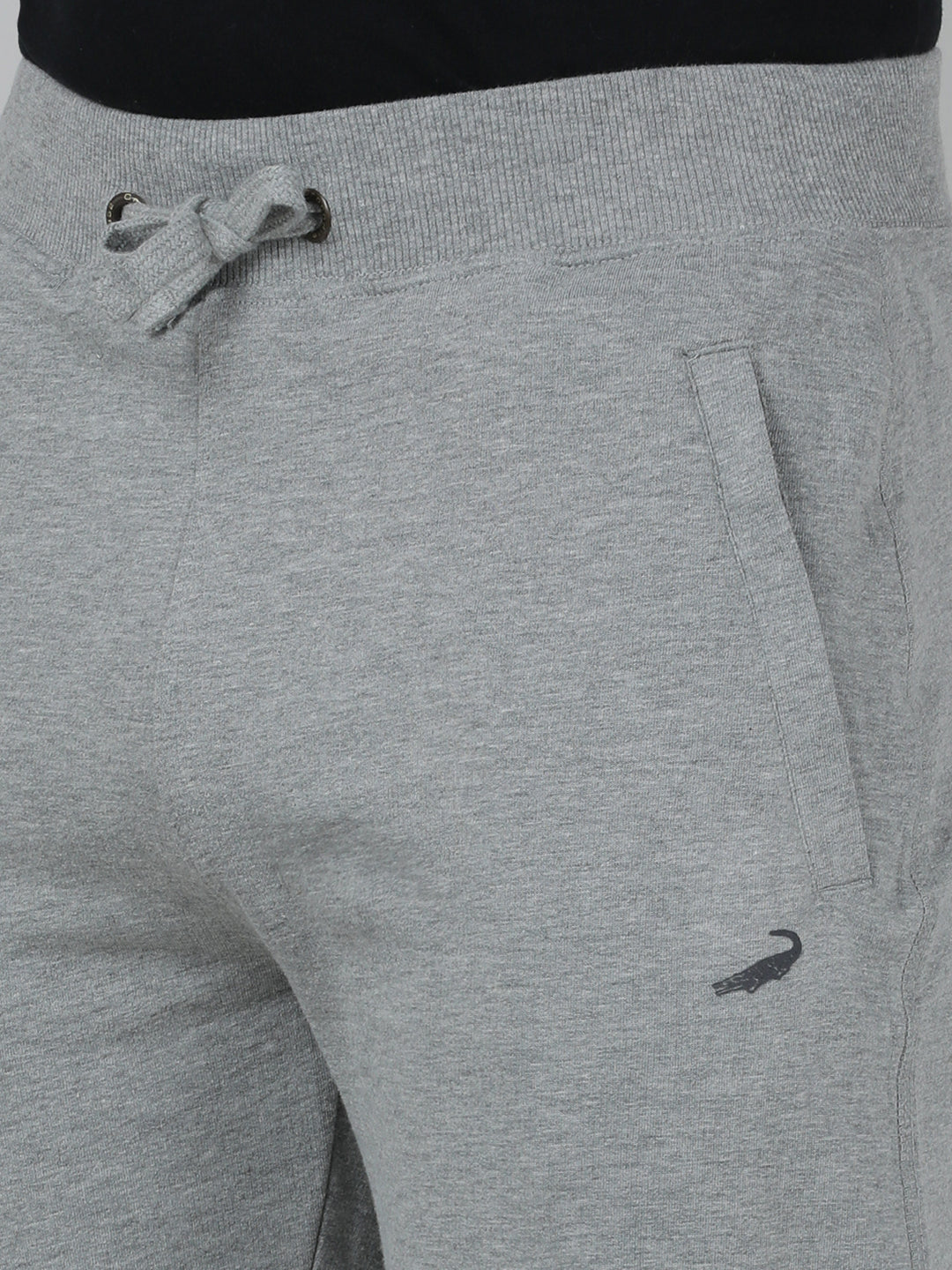 Gray sweatpants with a drawstring and small logo on a plain background