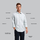 Man wearing a light gray shirt with text labels on a gray background