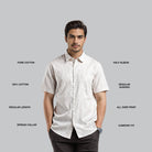 Man wearing a white short-sleeve shirt with text describing features on a gray background