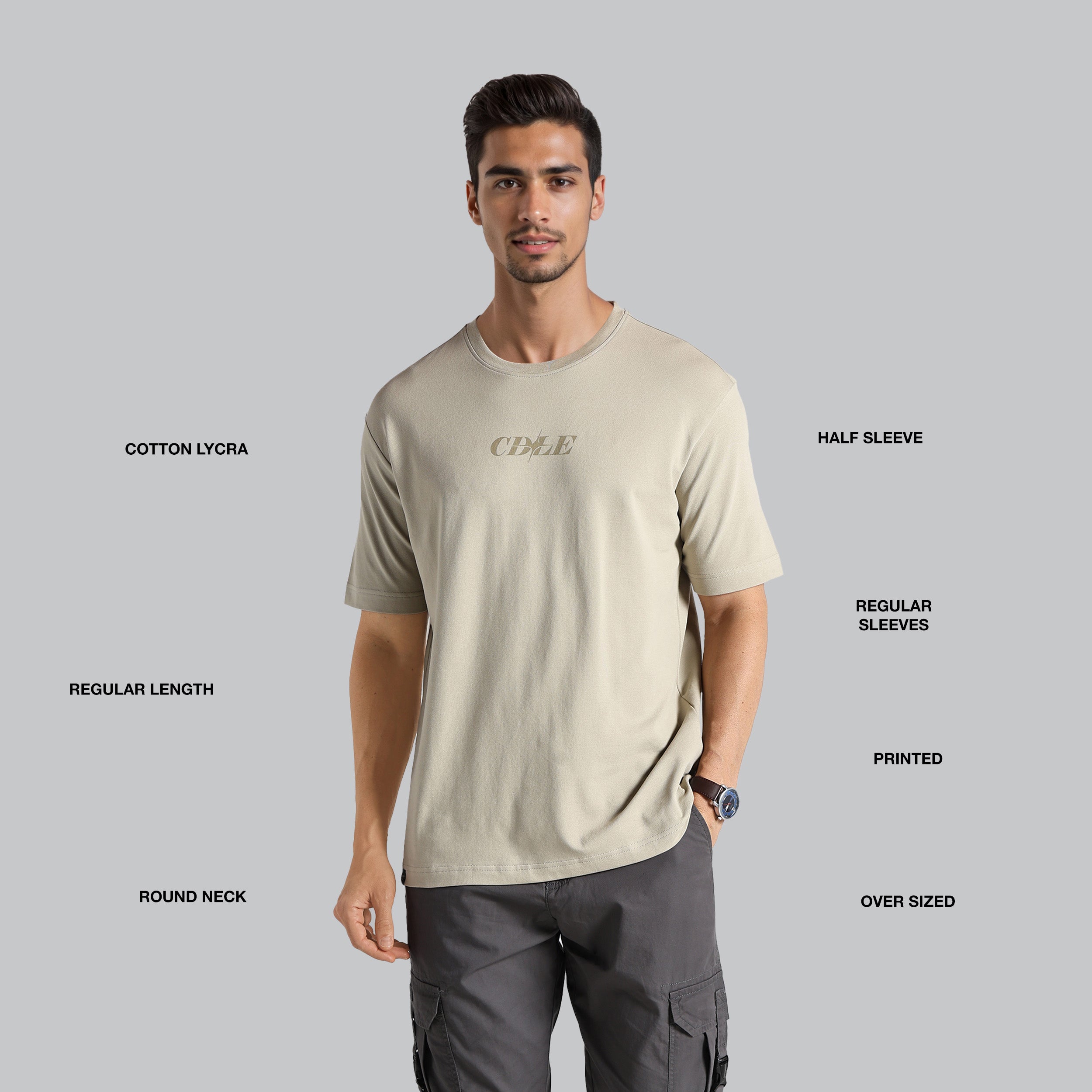 Man wearing a beige t-shirt with text on a gray background