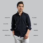 Man wearing a black shirt with text describing features on a gray background