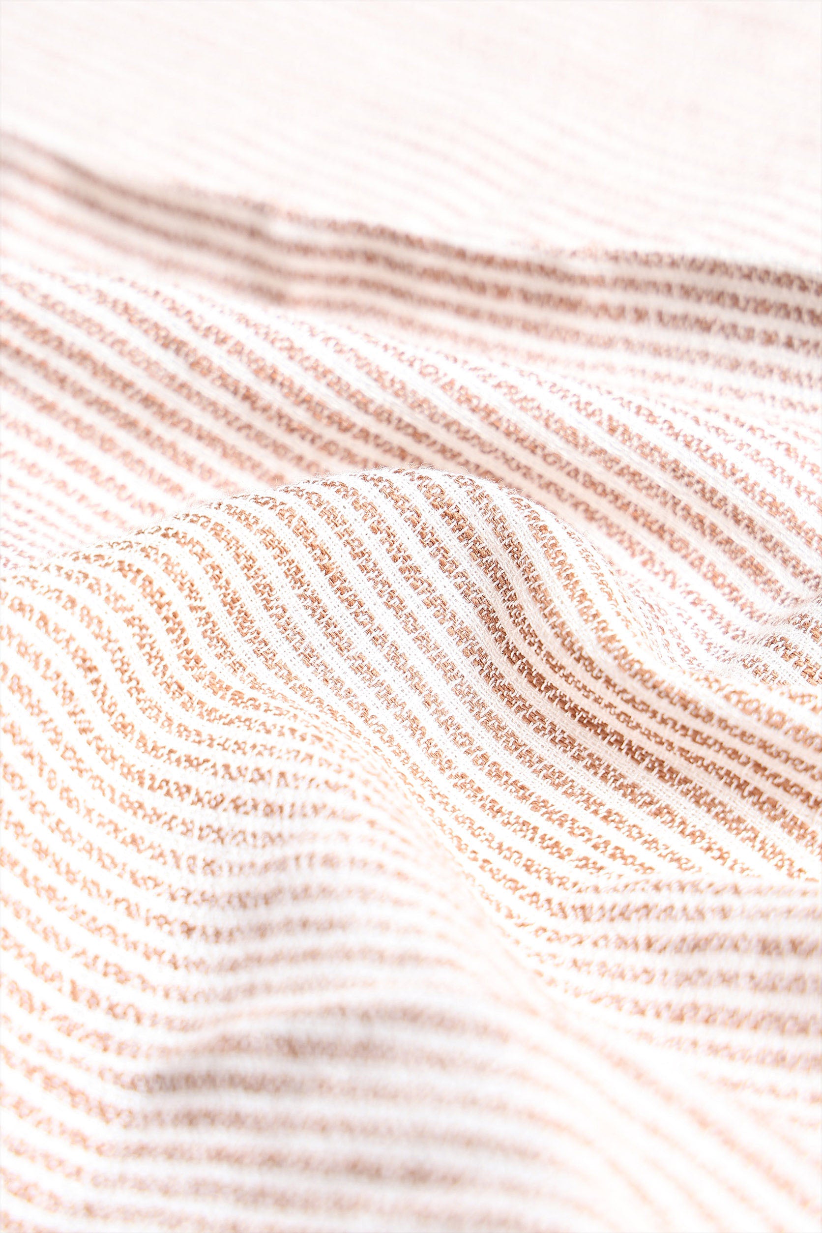 Close-up of textured fabric with wavy pattern